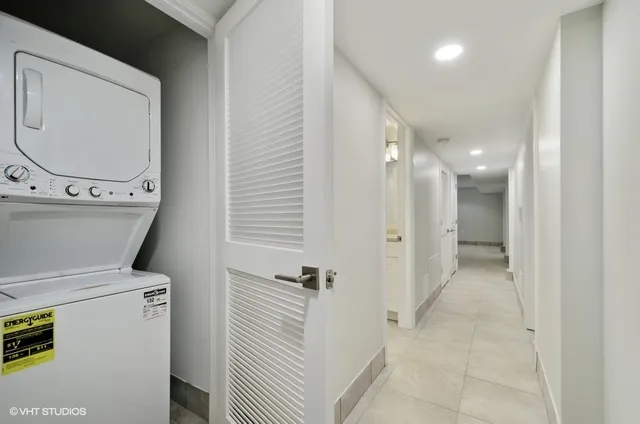 a bathroom with a granite countertop sink a toilet and a mirror