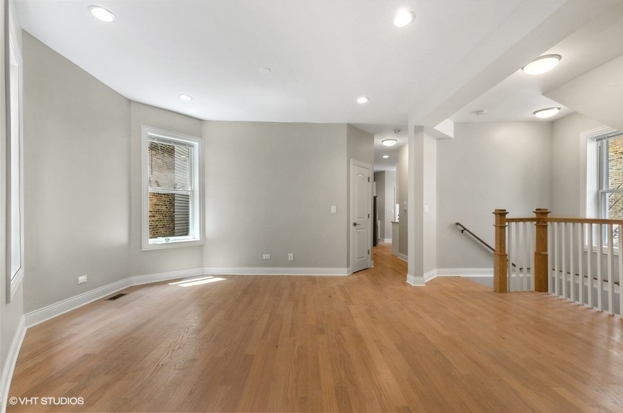 5816 North Ridge Avenue, Unit 1F Chicago, IL 60660 - Photo 4 of 18 a view of empty room with wooden floor