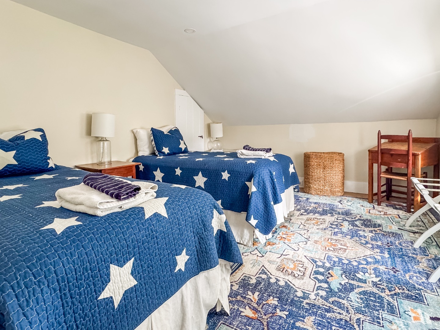 69 School Street Edgartown, MA 02539 - Photo 12 of 23 a bedroom with a bed and dresser