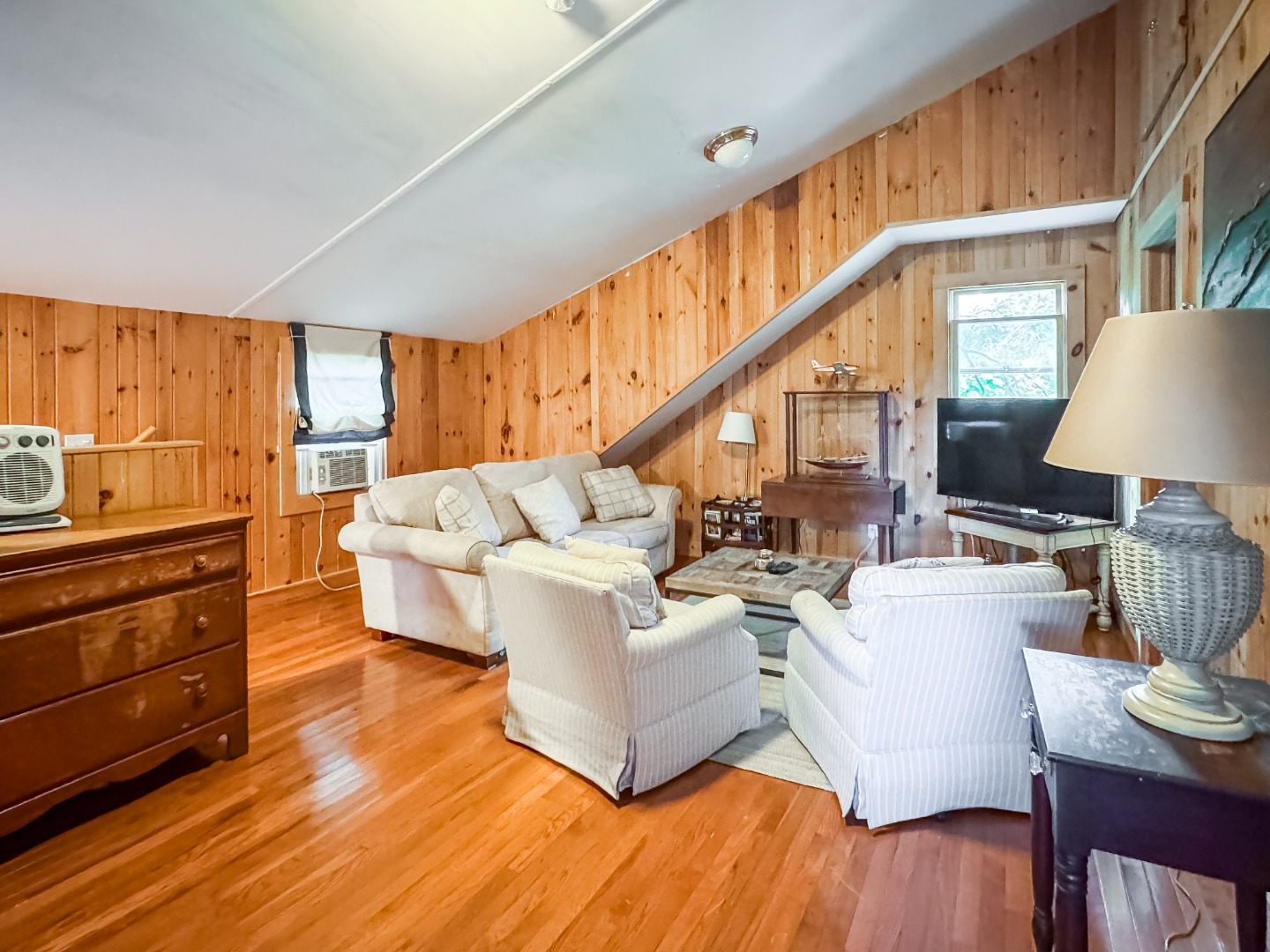 69 School Street Edgartown, MA 02539 - Photo 19 of 23 a living room with furniture and a wooden floor