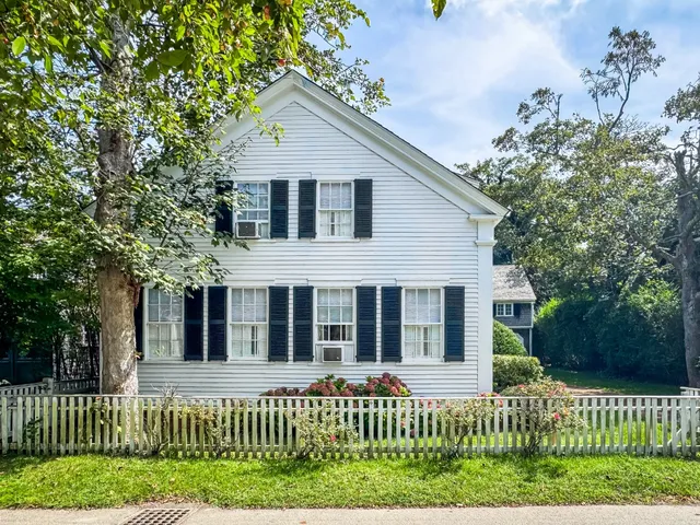 front view of a house with a small yard