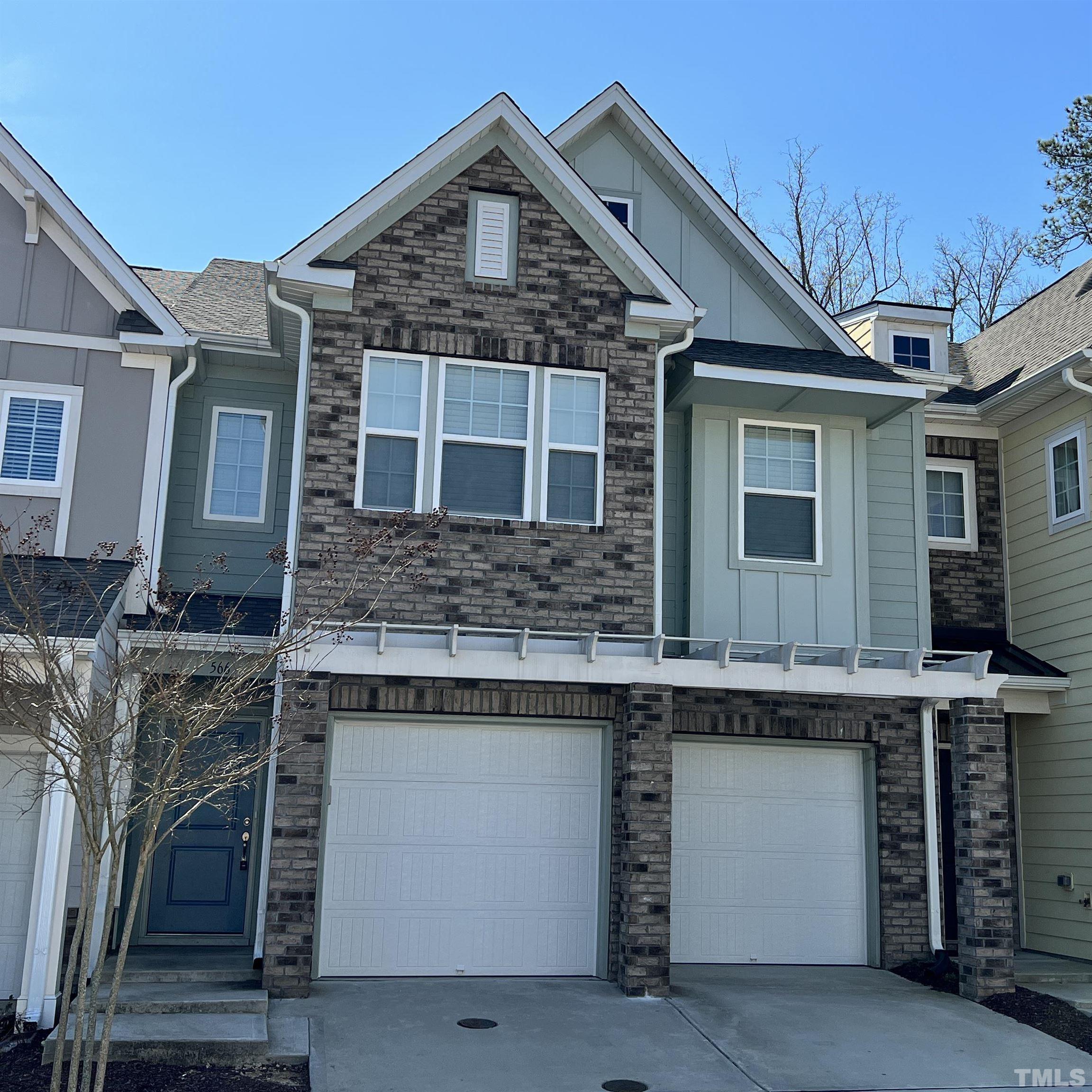 566 Chessie Station Apex, NC 27502 - Photo 1 of 29 a front view of a house with a garage