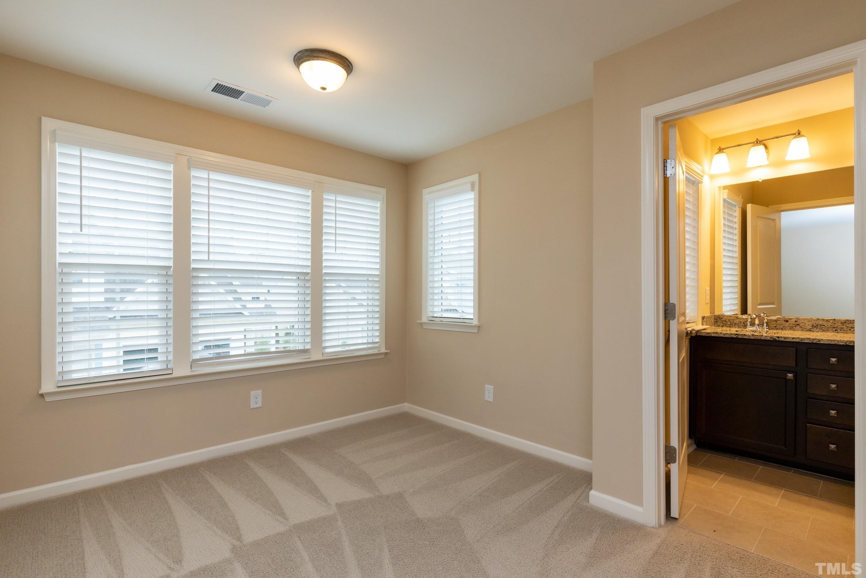 566 Chessie Station Apex, NC 27502 - Photo 19 of 29 a view of an empty room with a window