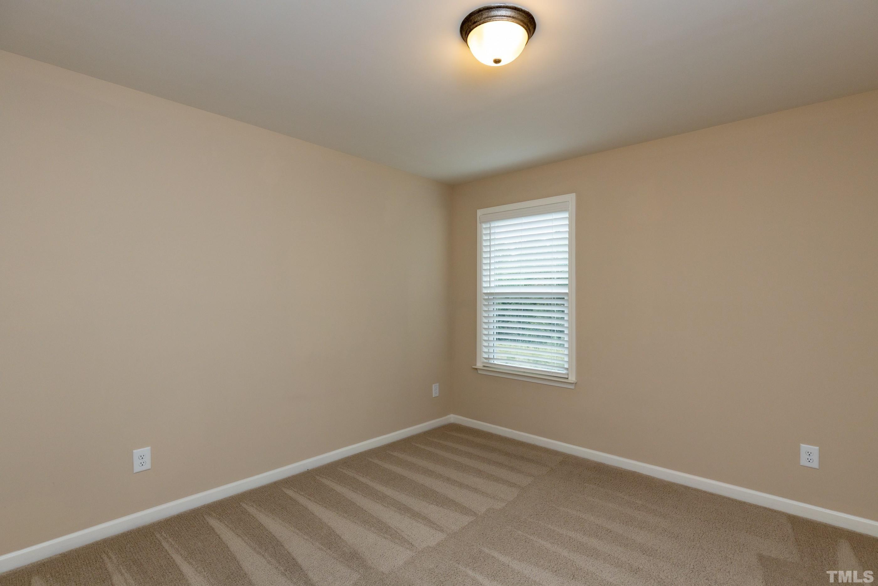 566 Chessie Station Apex, NC 27502 - Photo 22 of 29 an empty room with a window