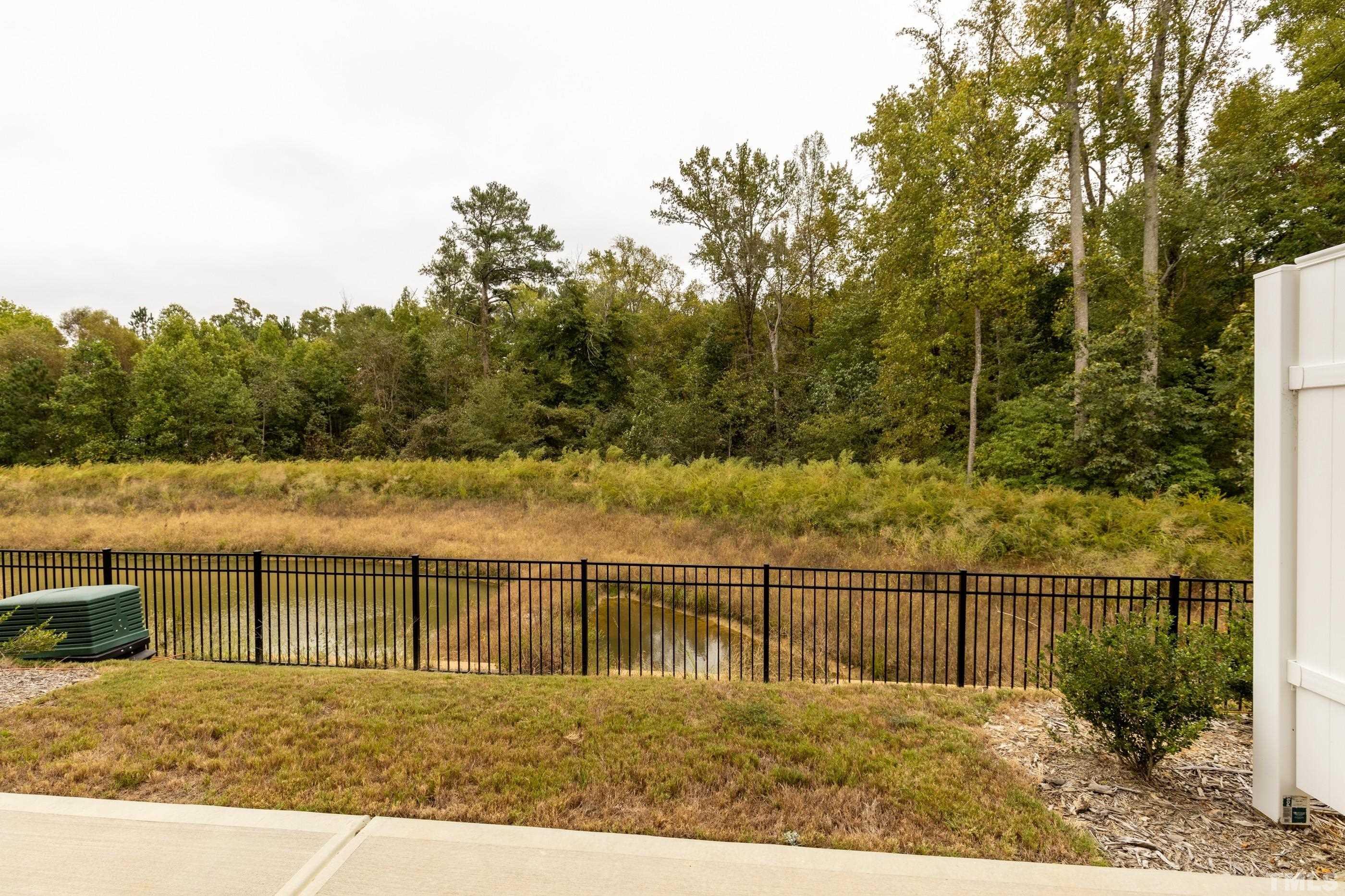 566 Chessie Station Apex, NC 27502 - Photo 28 of 29 a view of a balcony with a lake view