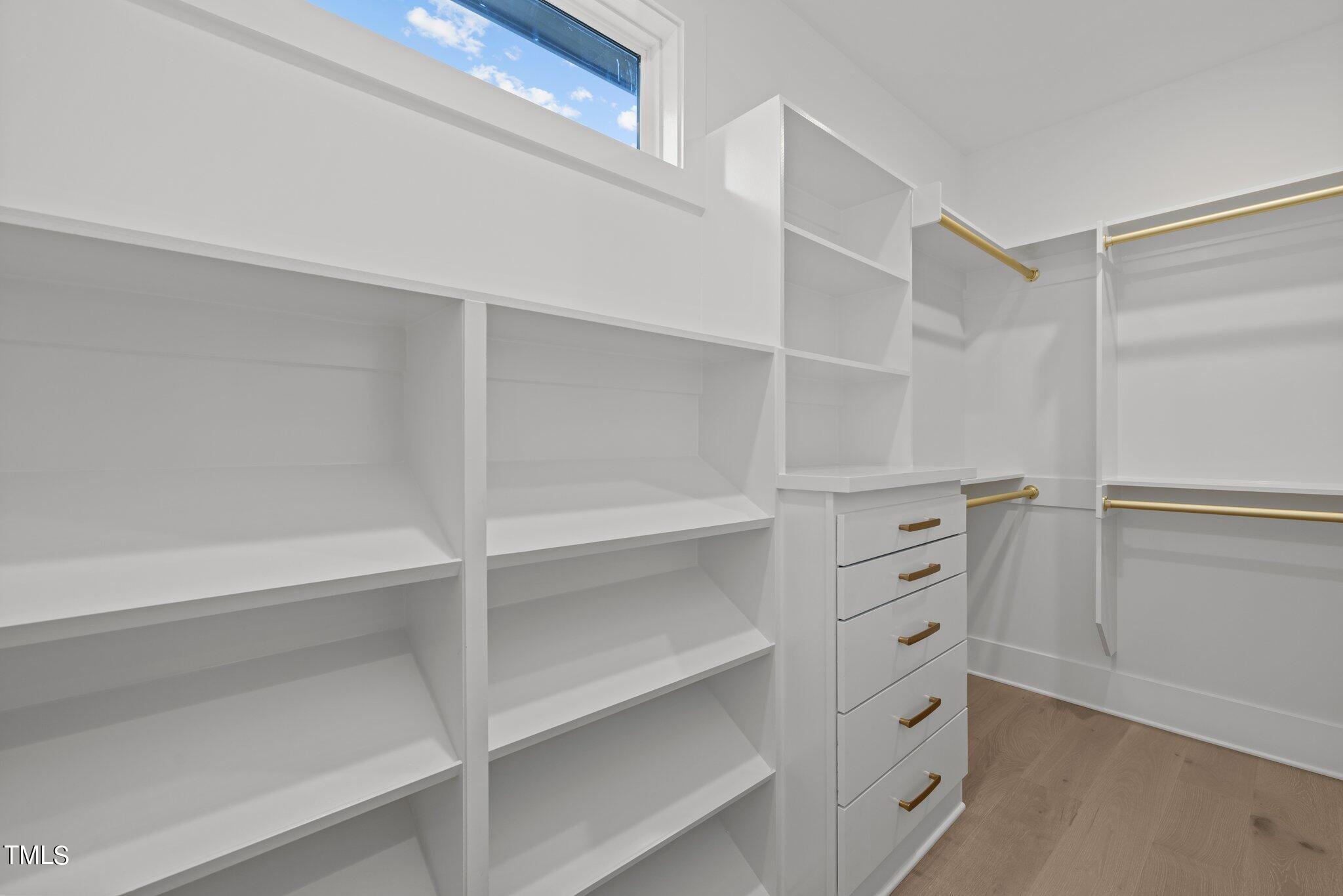 2309 Turners Alley Raleigh, NC 27607 - Photo 34 of 52 a view of walk in closet with empty racks