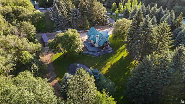 10686 South Covered Brg Cyn Road, Unit 14 Spanish Fork, UT 84660 - Photo 14 of 44 Multi-level residence with a distinct teal roof, surrounded by mature evergreen and deciduous trees