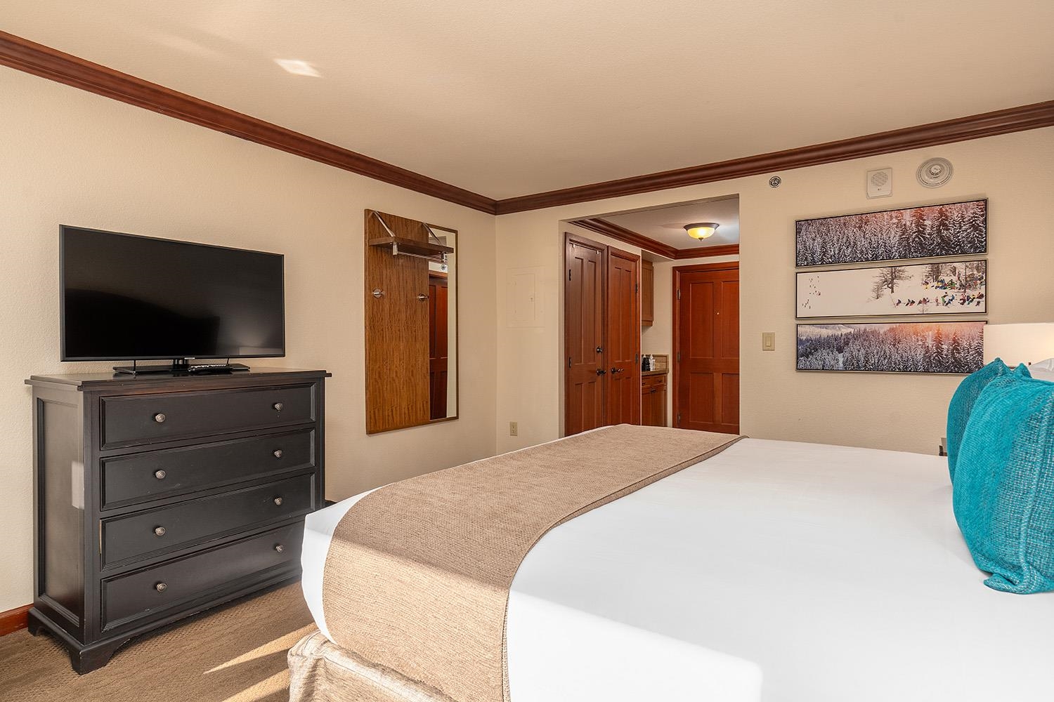 400 Resort Road, Unit 635 Olympic Valley, CA 96146 - Photo 5 of 23 a bedroom with a bed and a flat screen tv