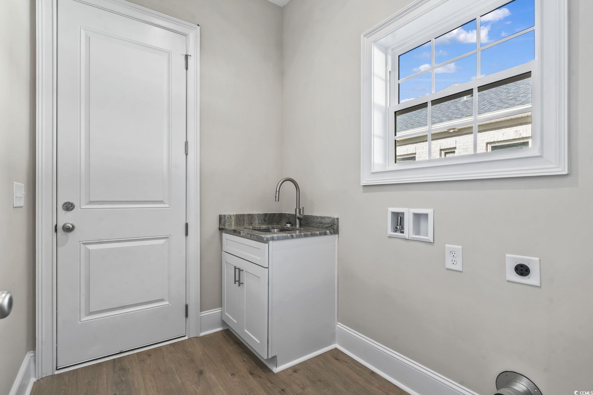 329 Waterfall Circle Little River, SC 29566 - Photo 12 of 39 Laundry area with dark wood finished floors, washer hookup, and electric dryer hookup