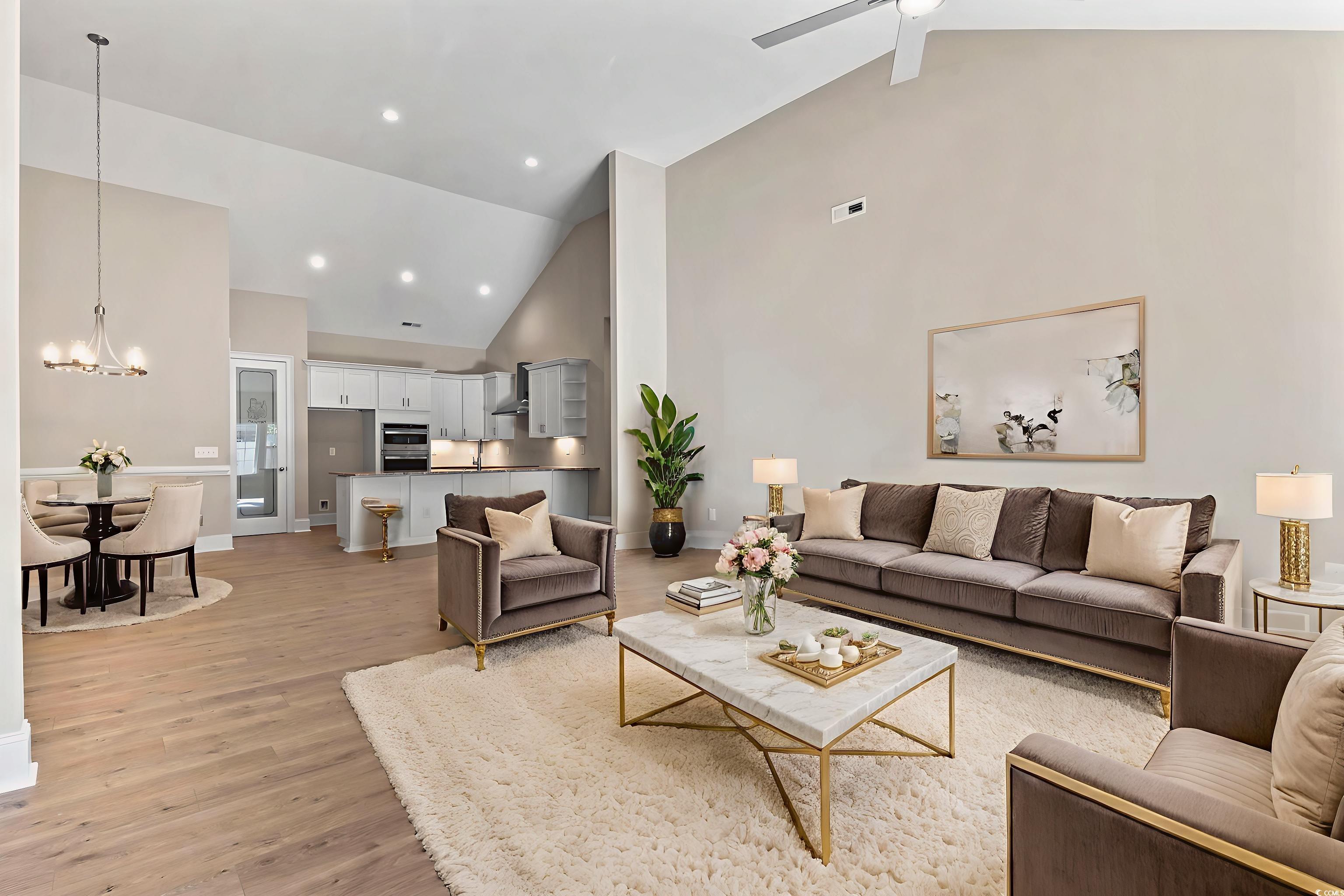 329 Waterfall Circle Little River, SC 29566 - Photo 19 of 39 Living area with high vaulted ceiling, a chandelier, light wood-style flooring, and recessed lighting