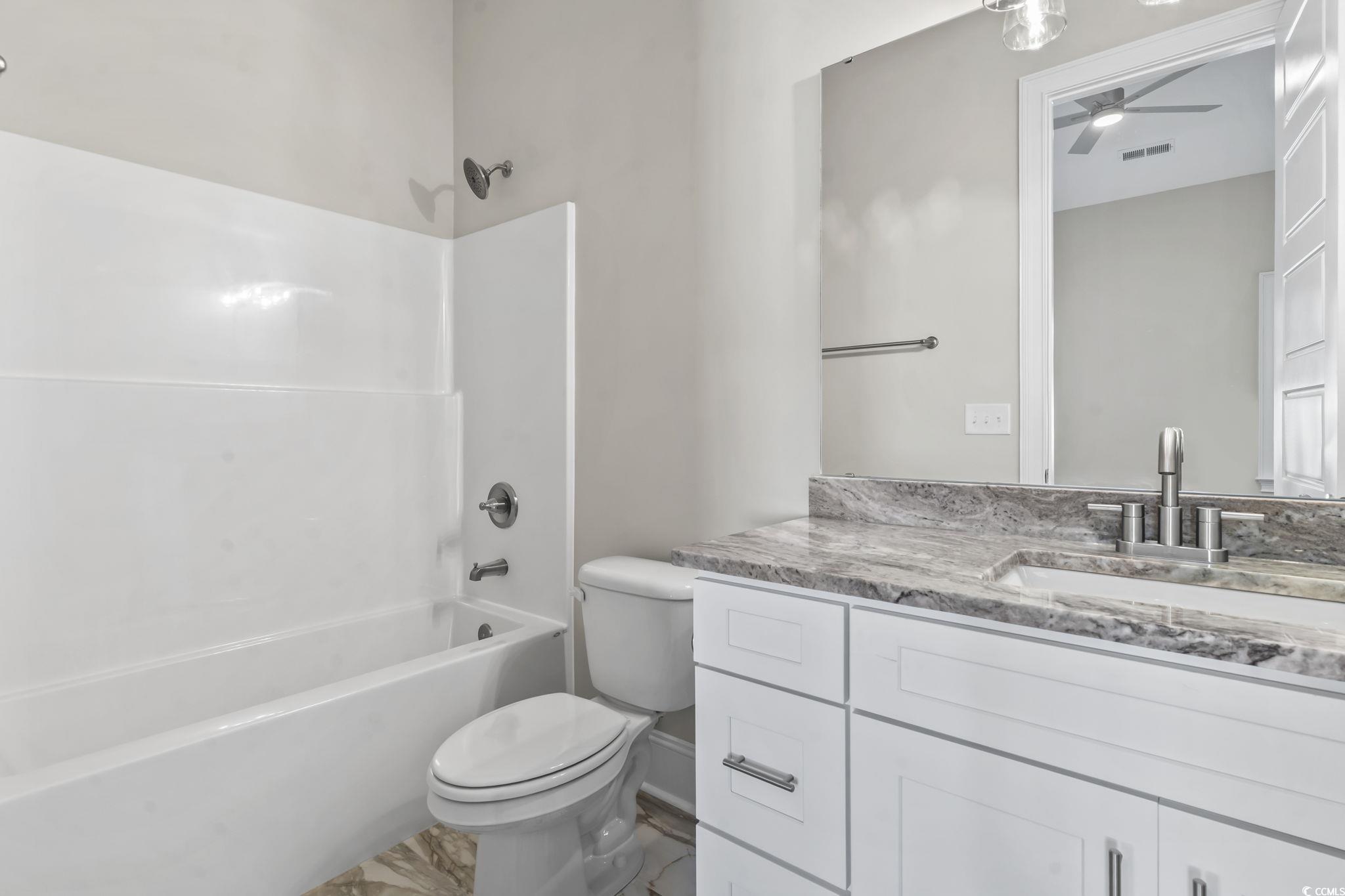 329 Waterfall Circle Little River, SC 29566 - Photo 24 of 39 Bathroom featuring shower / bath combination, vanity, and a ceiling fan