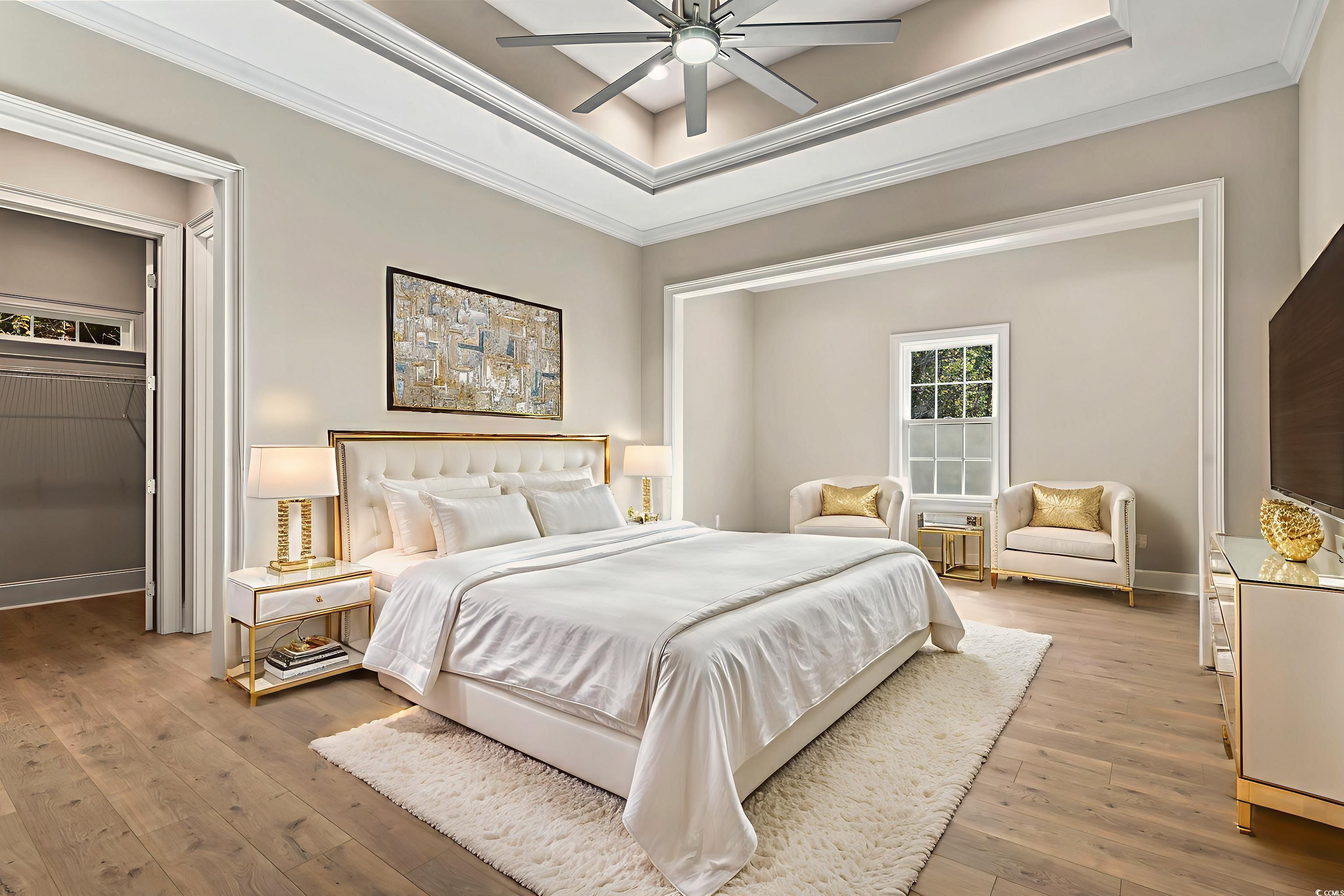 329 Waterfall Circle Little River, SC 29566 - Photo 26 of 39 Bedroom with crown molding, light wood-style flooring, a raised ceiling, and ceiling fan