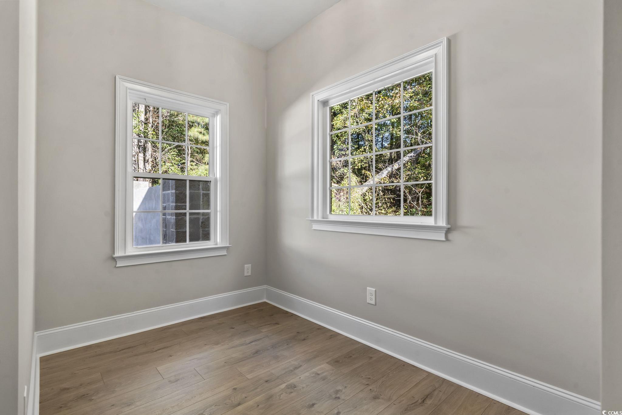 329 Waterfall Circle Little River, SC 29566 - Photo 28 of 39 Unfurnished room with baseboards and wood finished floors