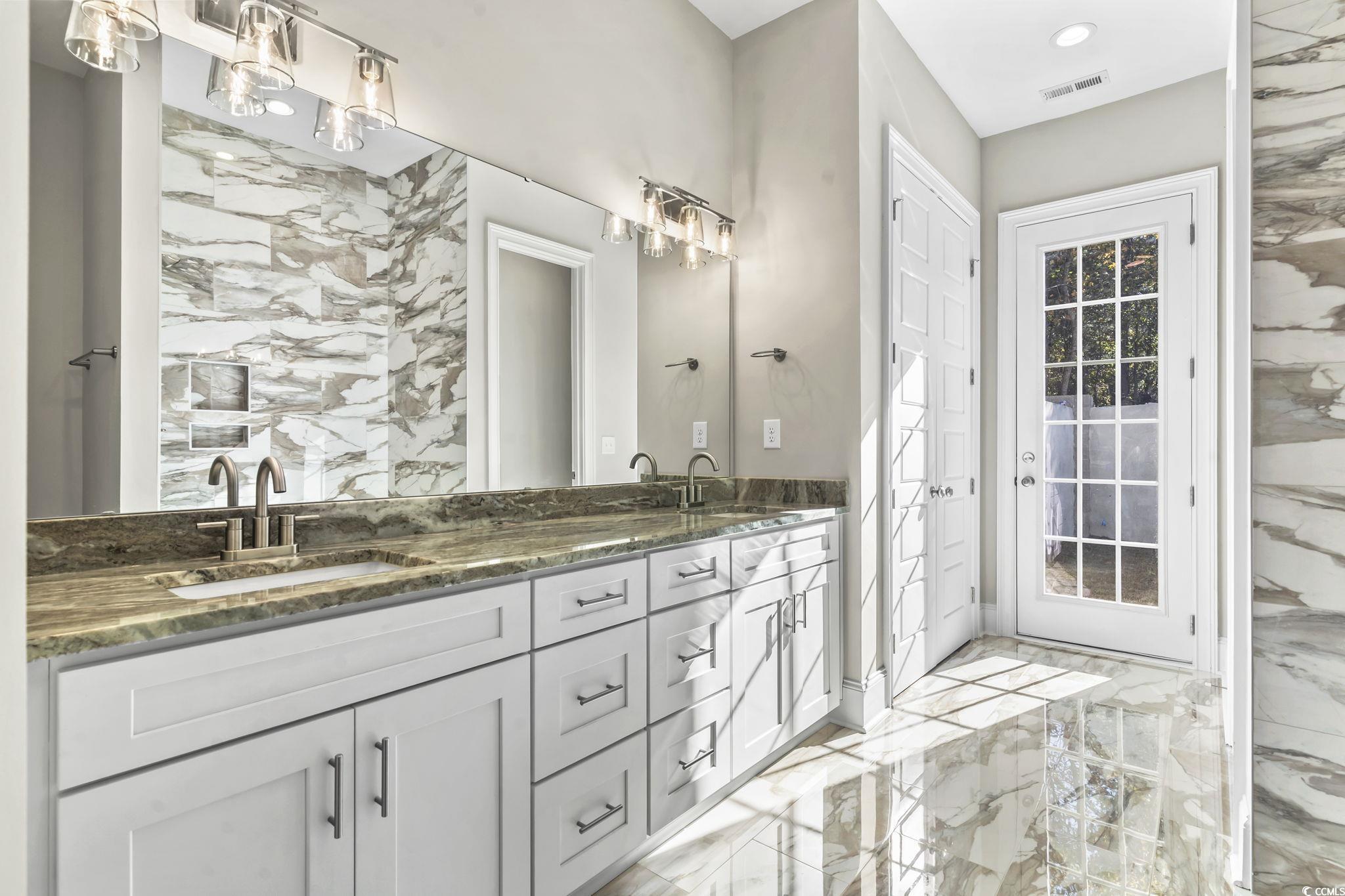 329 Waterfall Circle Little River, SC 29566 - Photo 30 of 39 Bathroom with light marble finish floors and double vanity