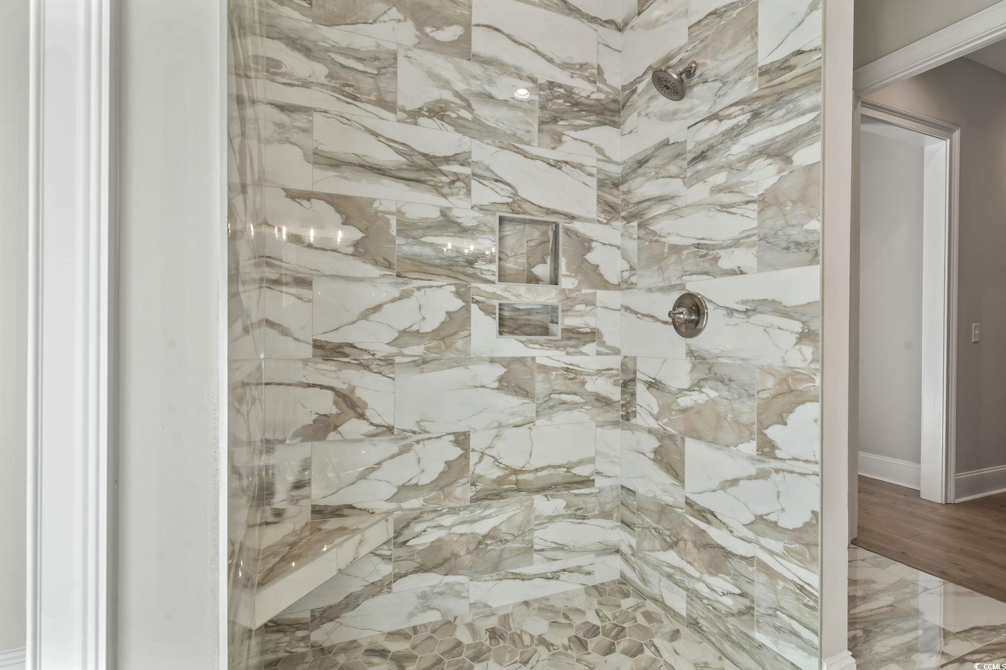 329 Waterfall Circle Little River, SC 29566 - Photo 32 of 39 Bathroom view of a marble finish shower and baseboards