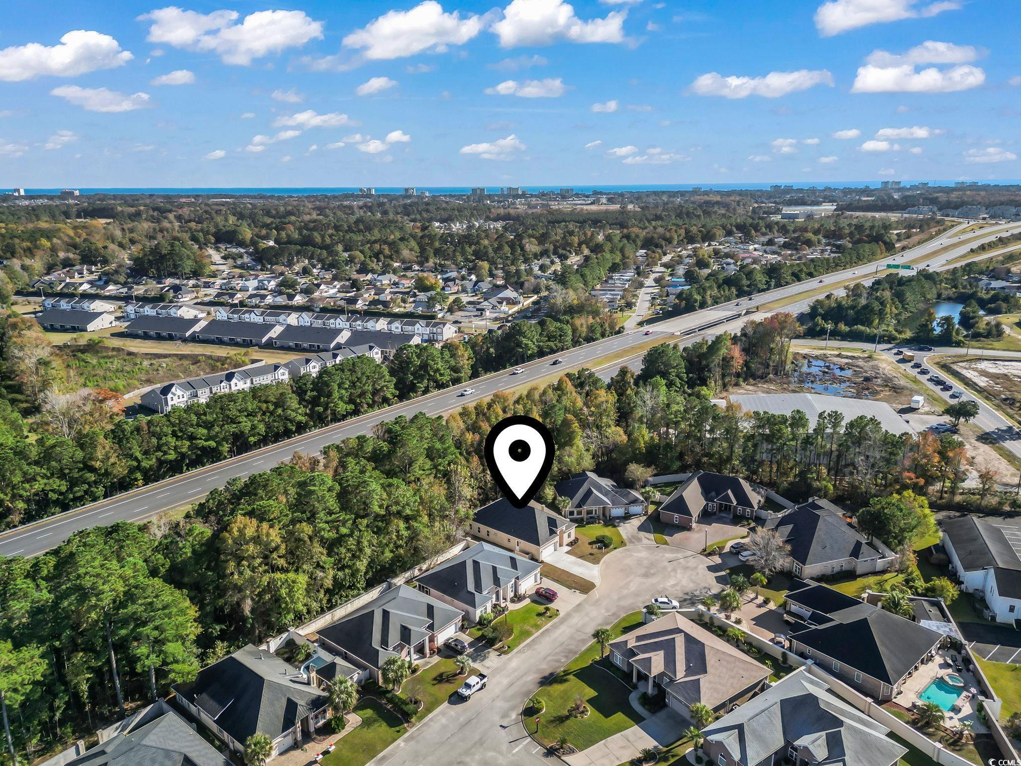 329 Waterfall Circle Little River, SC 29566 - Photo 38 of 39 Aerial view of property's location with a tree filled landscape and nearby suburban area