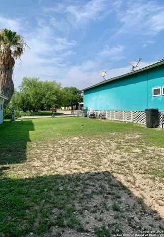 a large body of water with a large trees in the background