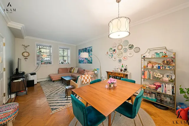 a picture of a bench in front of a wall