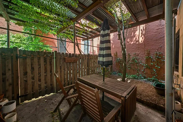 a bedroom with furniture and wooden floor