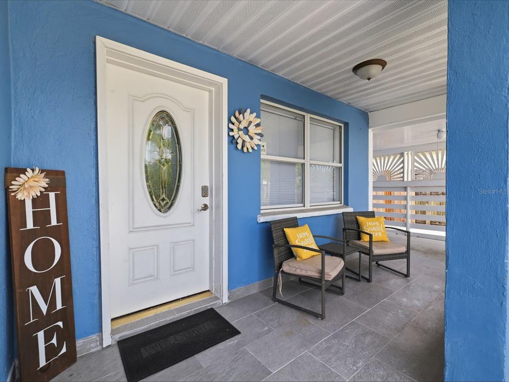 1207 1st Street Indian Rocks Beach, FL 33785 - Photo 5 of 60 a living room with furniture and a window