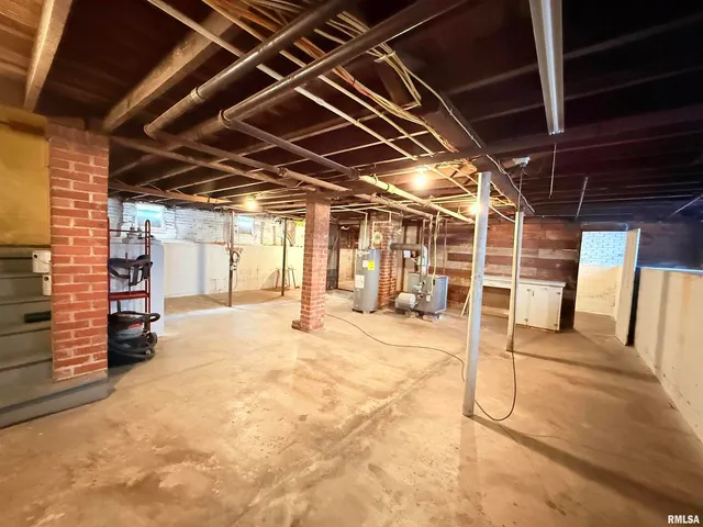 a view of empty room with wooden ceiling