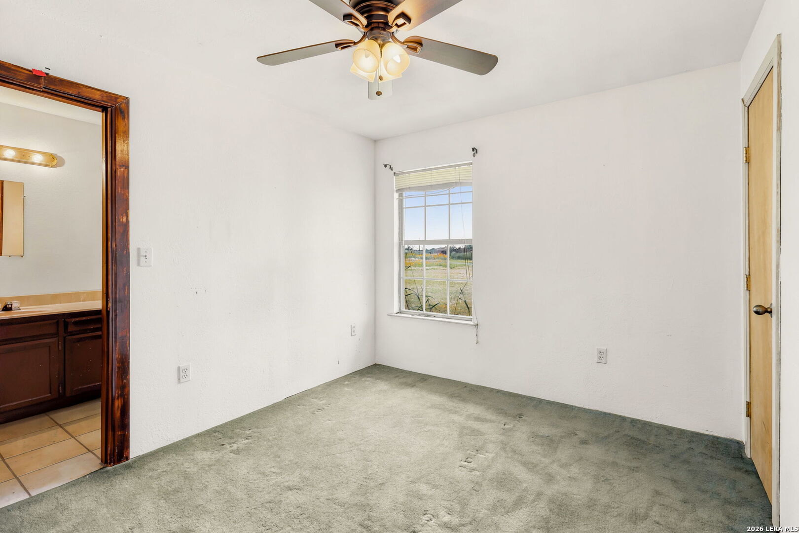 3061 Horse Ranch Road San Antonio, TX 78264 - Photo 15 of 34 a view of an empty room with a window