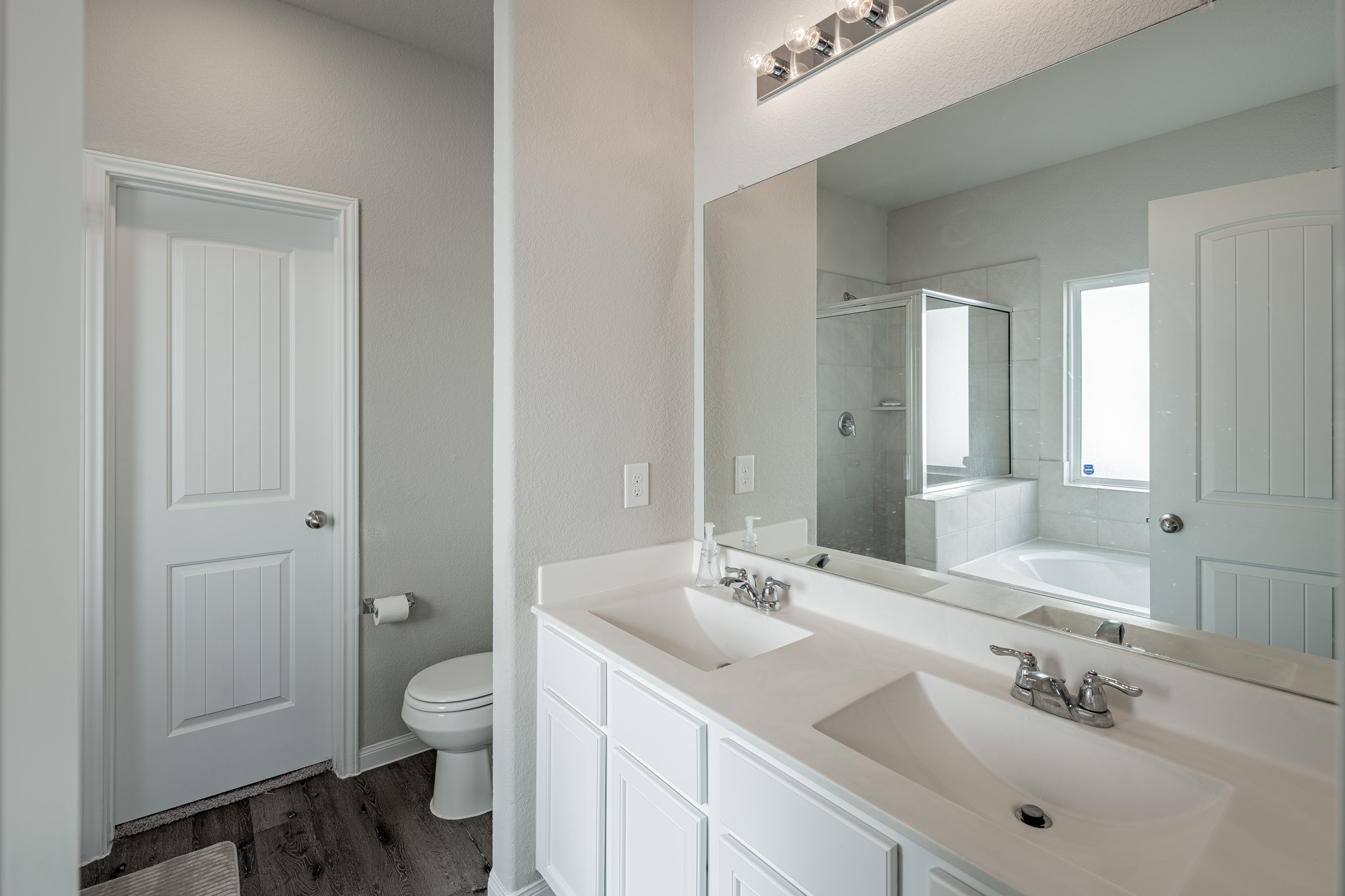 4923 Blue Jacaranda Way Spring Spring, TX 77373 - Photo 13 of 25 a bathroom with a sink double vanity and a toilet