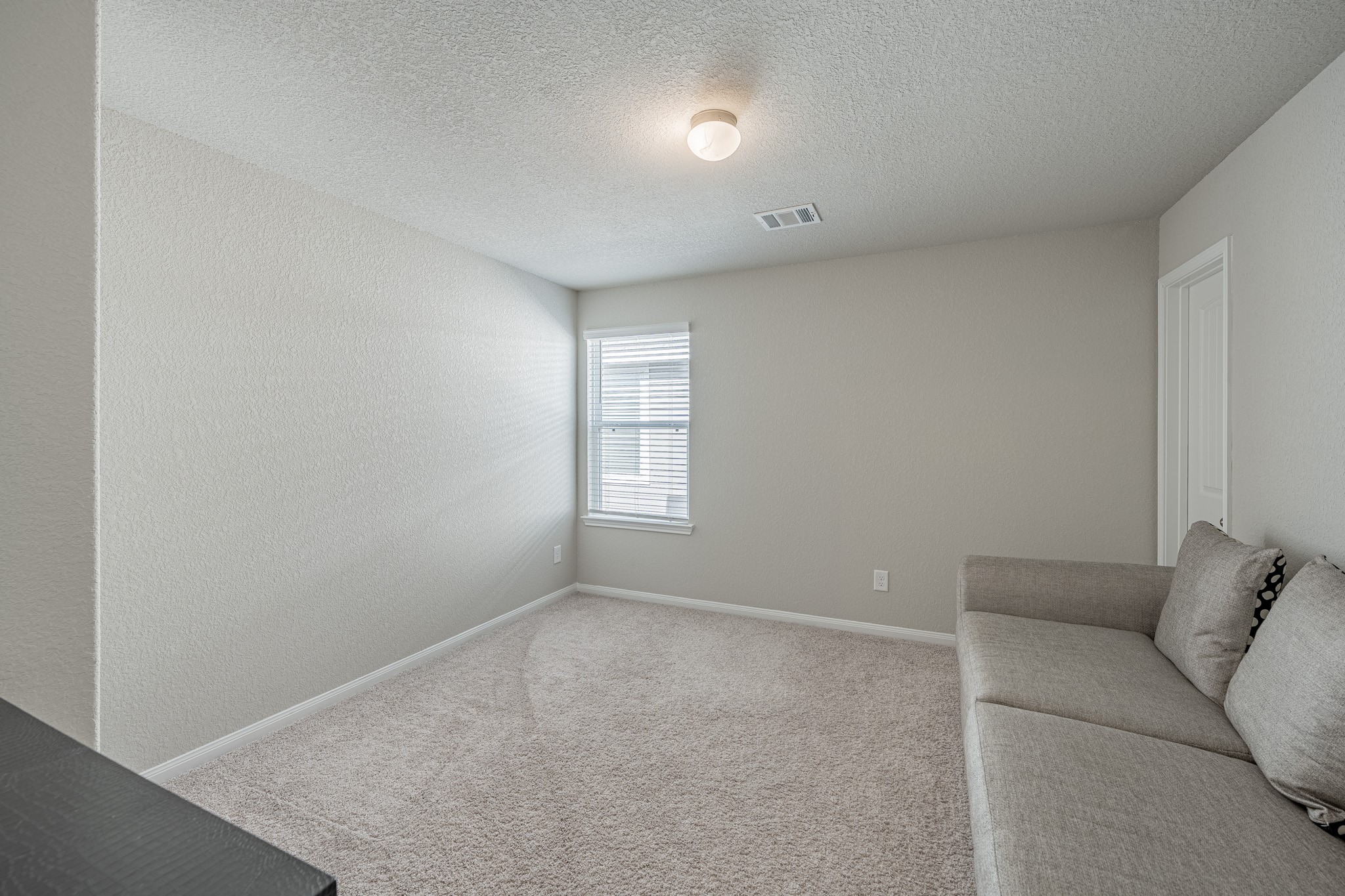 4923 Blue Jacaranda Way Spring Spring, TX 77373 - Photo 18 of 25 a living room with furniture and a window
