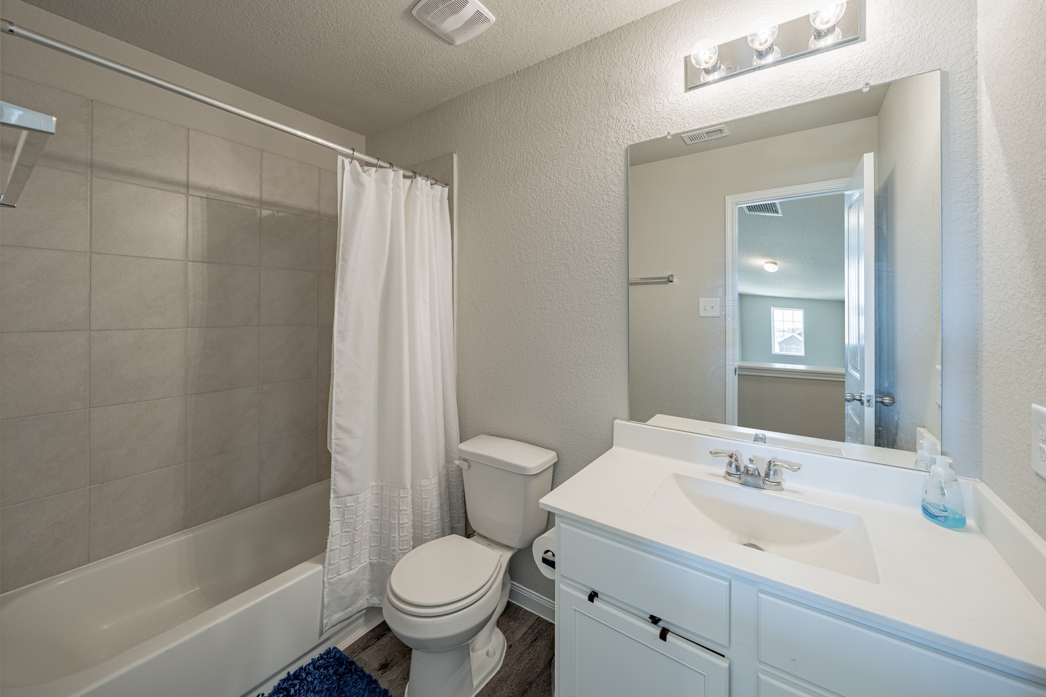 4923 Blue Jacaranda Way Spring Spring, TX 77373 - Photo 22 of 25 a bathroom with a sink toilet and shower