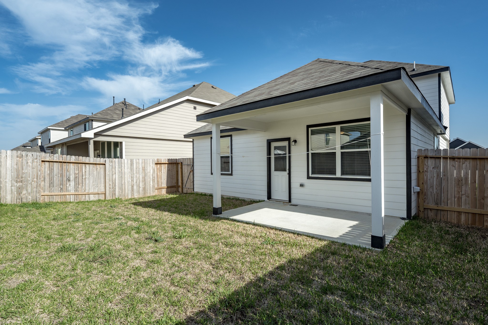 4923 Blue Jacaranda Way Spring Spring, TX 77373 - Photo 23 of 25 a house that has tree in front of it