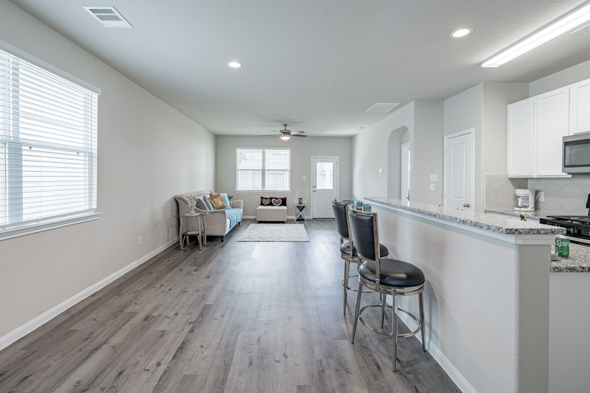 4923 Blue Jacaranda Way Spring Spring, TX 77373 - Photo 6 of 25 a living room with furniture and a wooden floor