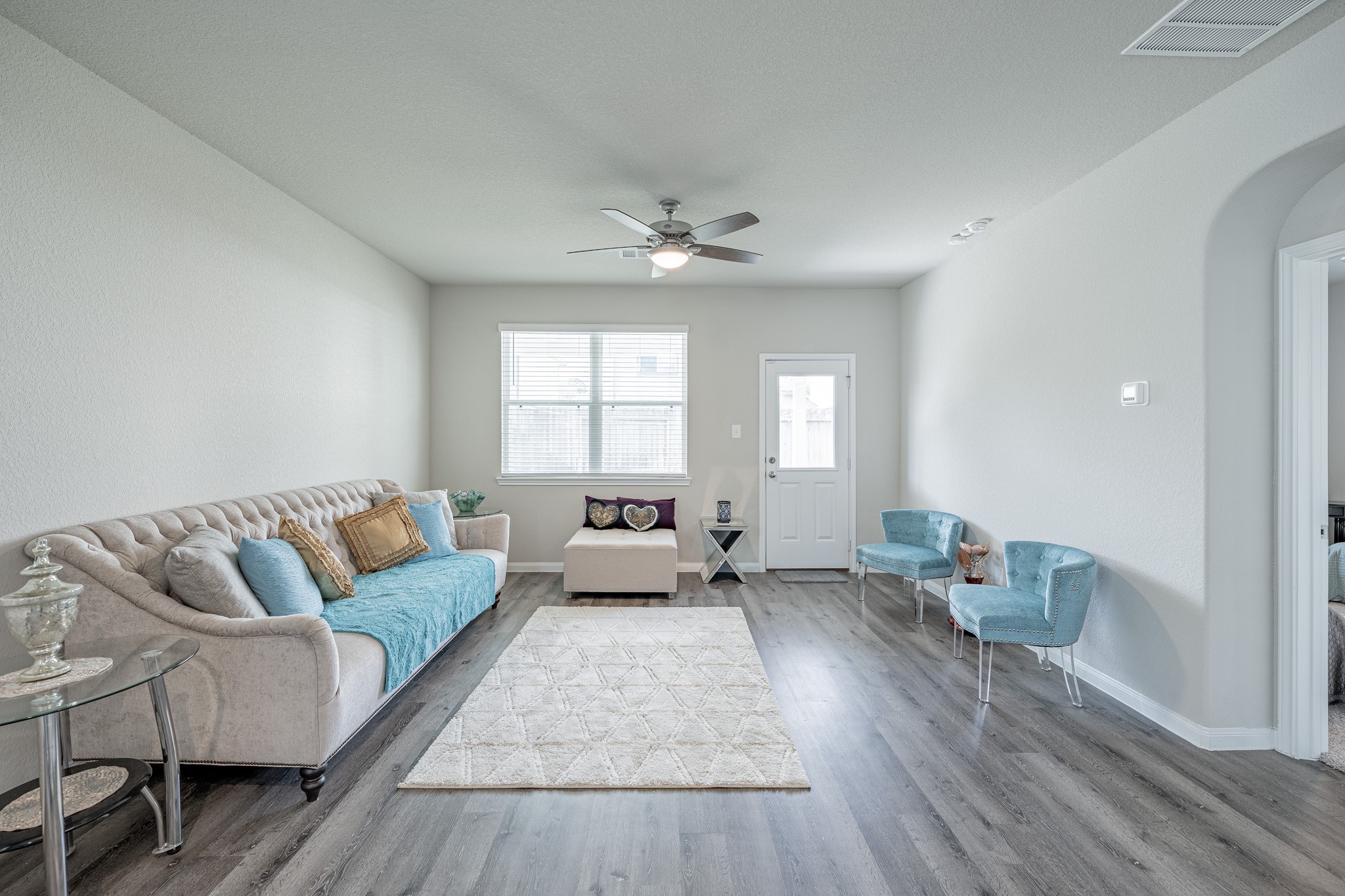 4923 Blue Jacaranda Way Spring Spring, TX 77373 - Photo 9 of 25 a living room with furniture and a large window