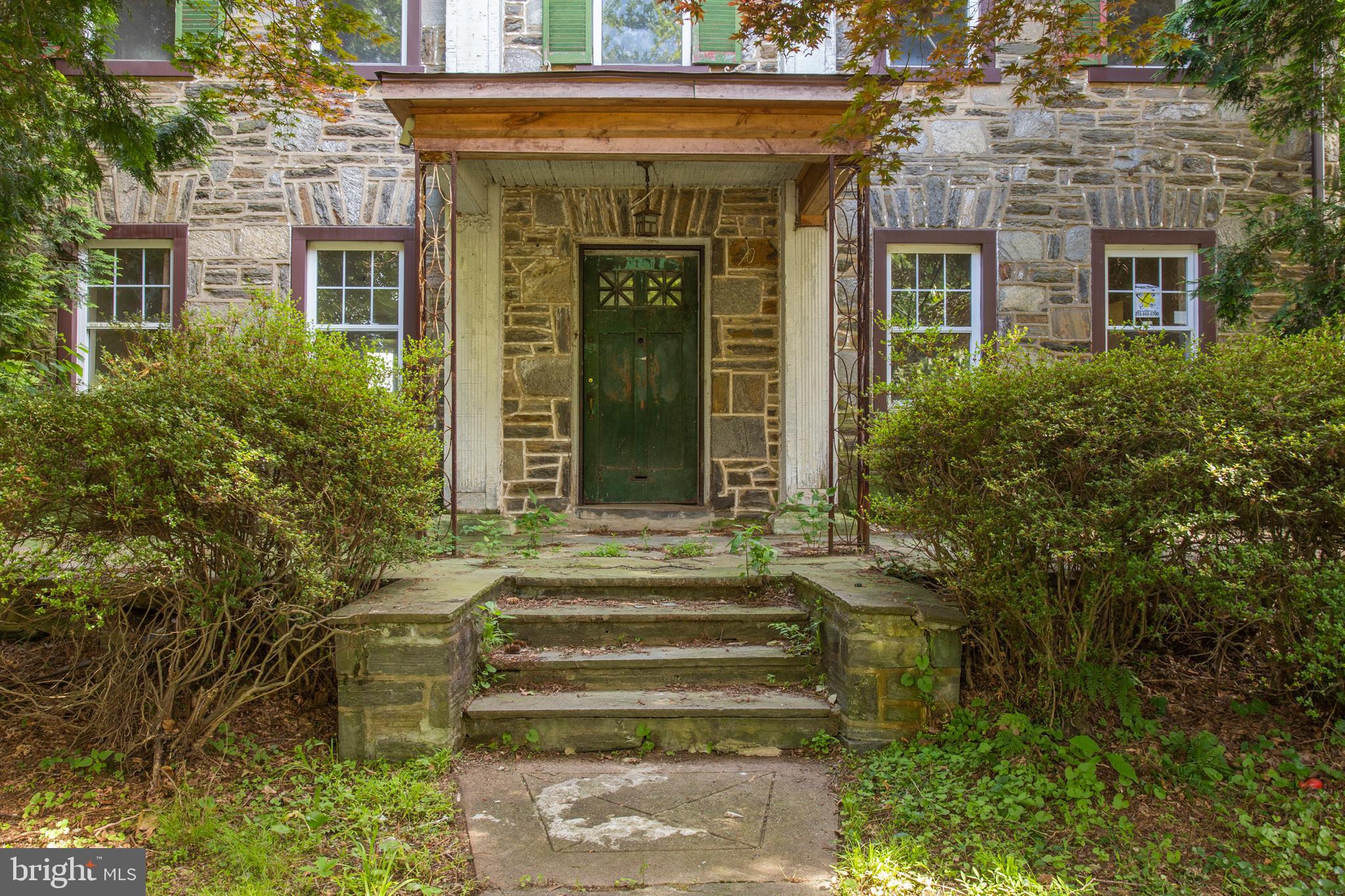 5200 Overbrook Avenue Philadelphia, PA 19131 - Photo 2 of 37 a front view of a house with a garden