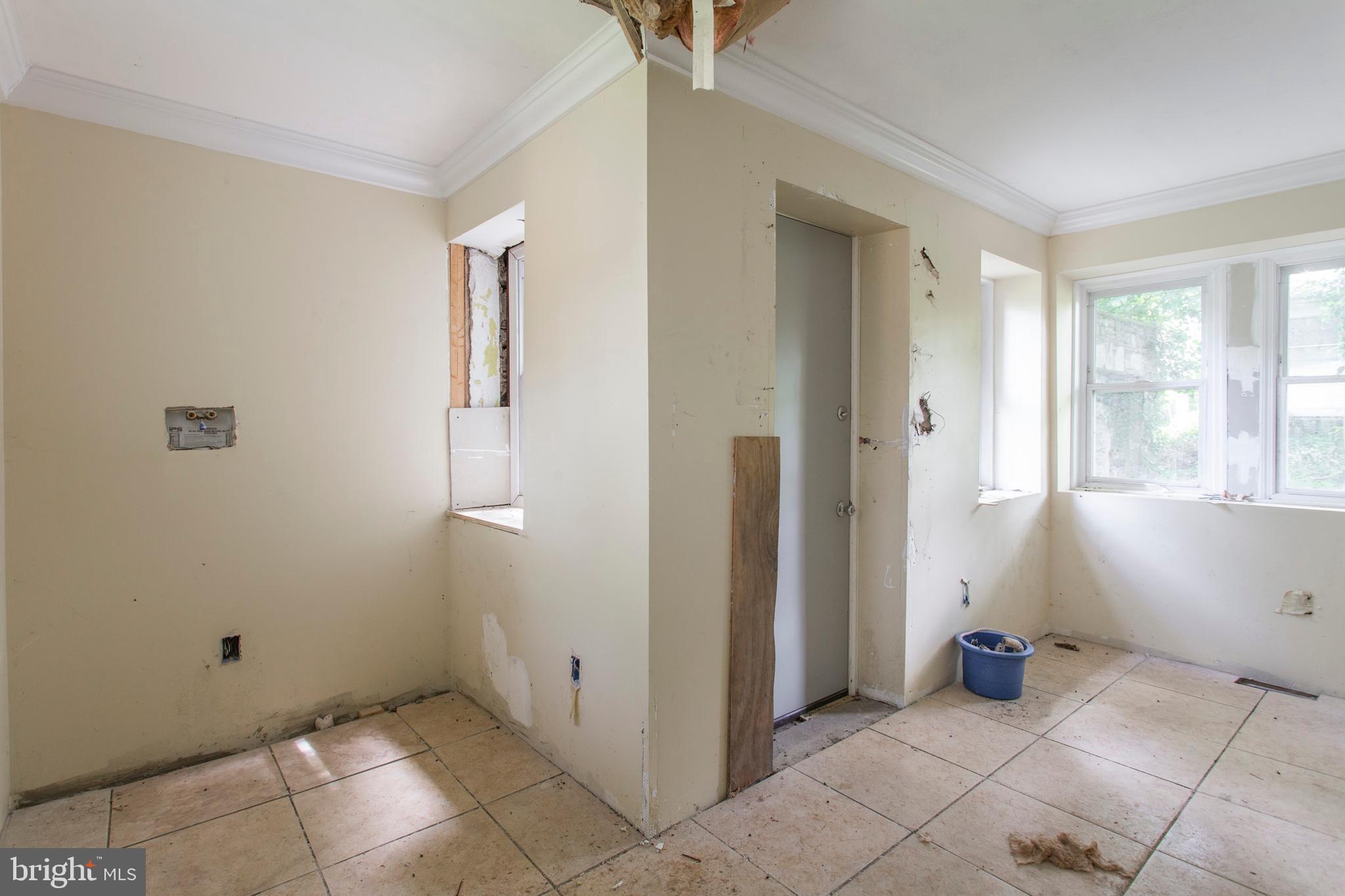 5200 Overbrook Avenue Philadelphia, PA 19131 - Photo 16 of 37 a view of a livingroom with wooden floor and windows
