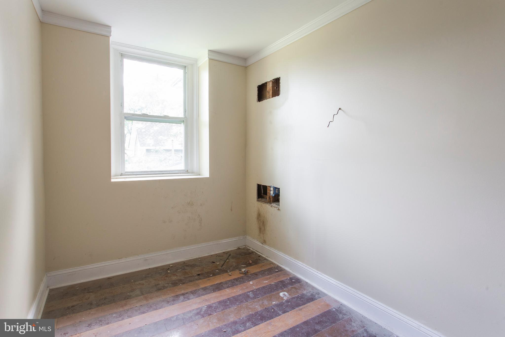 5200 Overbrook Avenue Philadelphia, PA 19131 - Photo 18 of 37 an empty room with wooden floor and windows