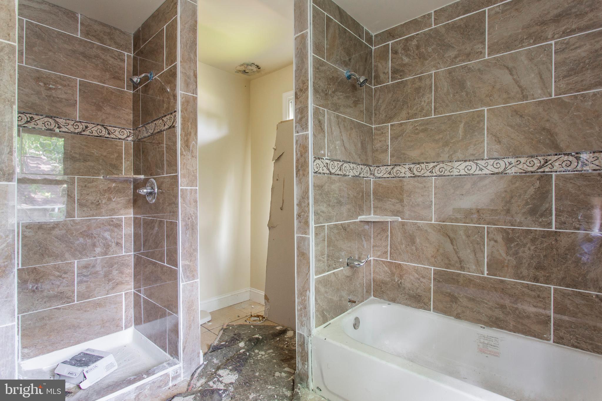 5200 Overbrook Avenue Philadelphia, PA 19131 - Photo 23 of 37 a bathroom with a bathtub and a shower