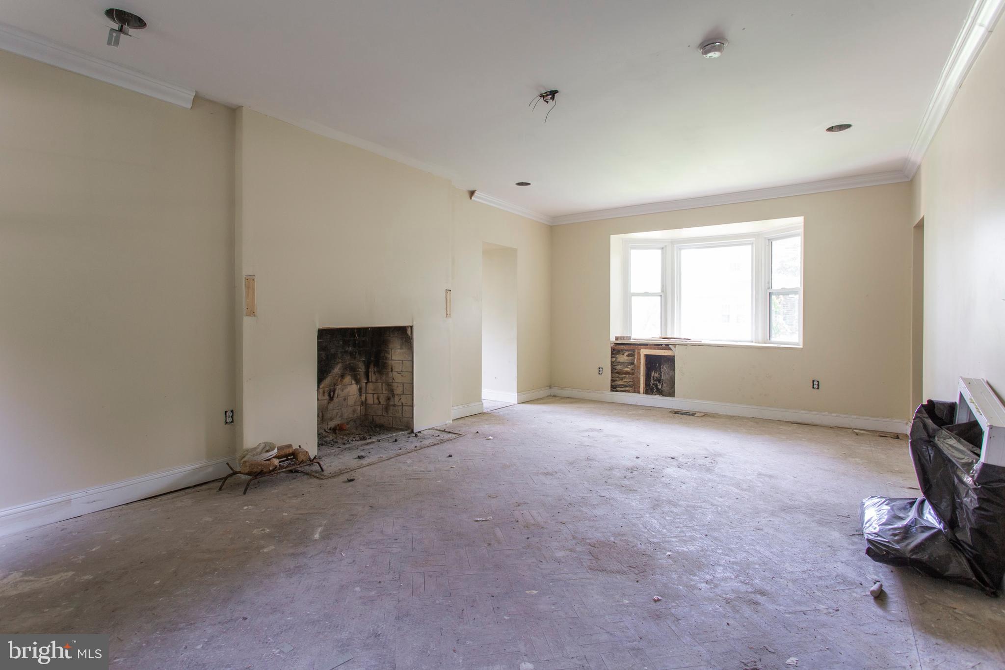 5200 Overbrook Avenue Philadelphia, PA 19131 - Photo 4 of 37 a view of empty room with a fireplace and window