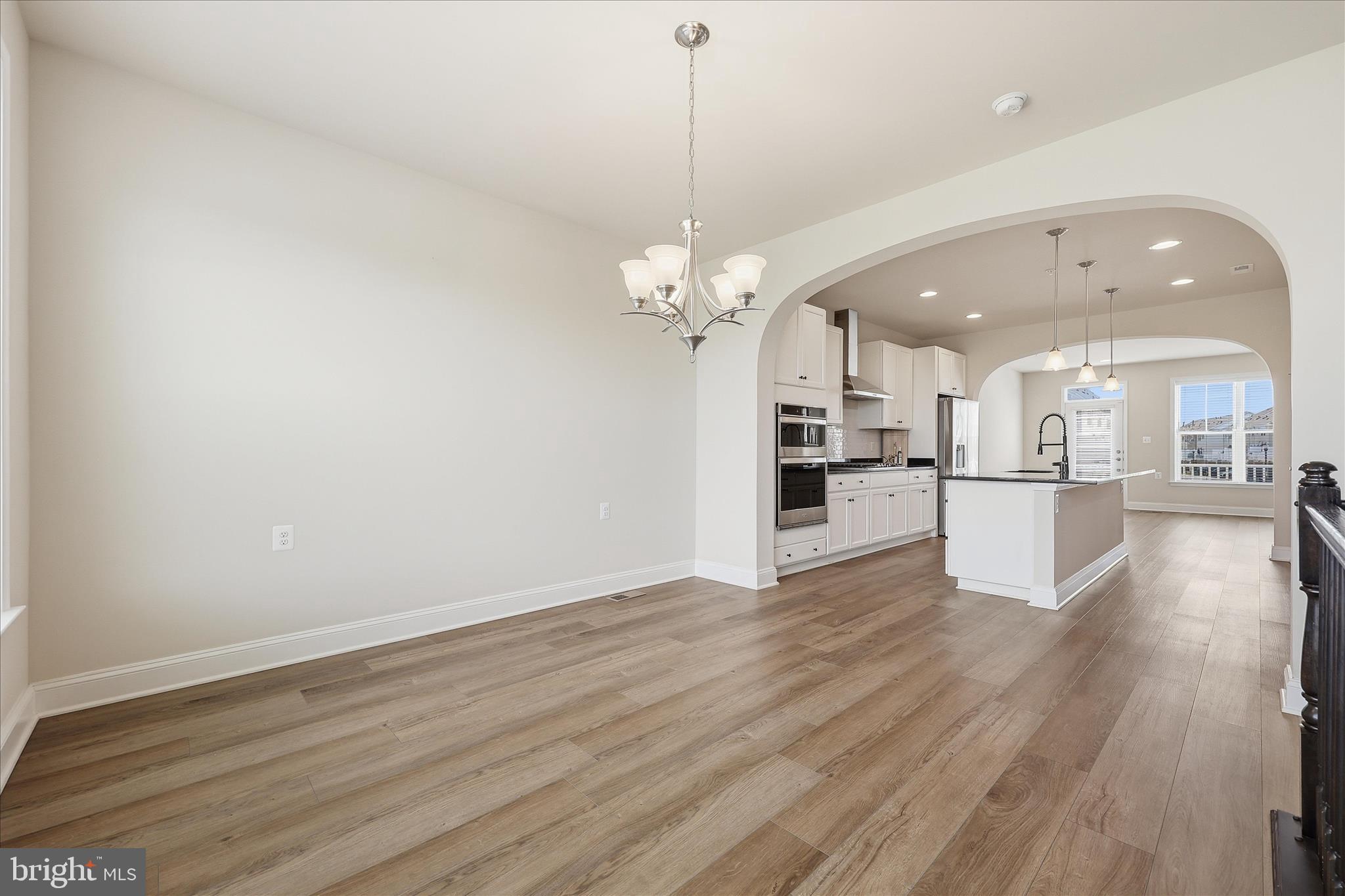 1090 Holden Road Frederick, MD 21701 - Photo 13 of 60 a view of a kitchen with wooden floor and a kitchen