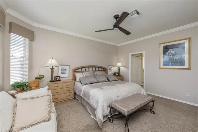 a bedroom with bed and window