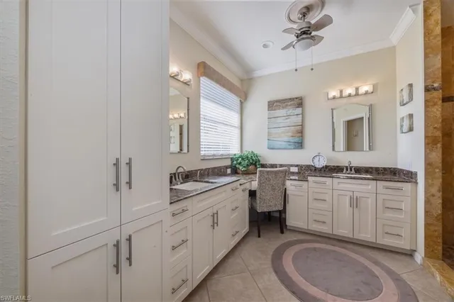 a spacious bathroom with a granite countertop sink mirror and a toilet
