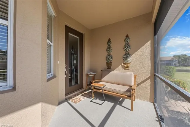 a living room with a bed and a window