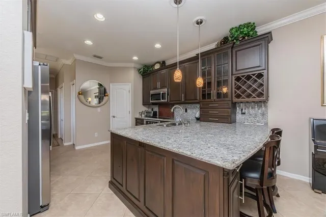 a kitchen with a table and chairs in it