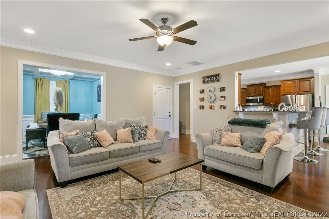 180 The Inner Circle Spring Lake, NC 28390 - Photo 11 of 50 a living room with furniture and white walls