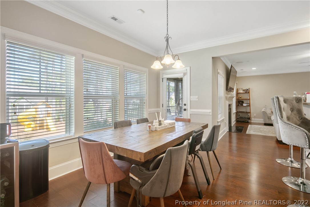 180 The Inner Circle Spring Lake, NC 28390 - Photo 19 of 50 a view of a dining room with furniture window and wooden floor