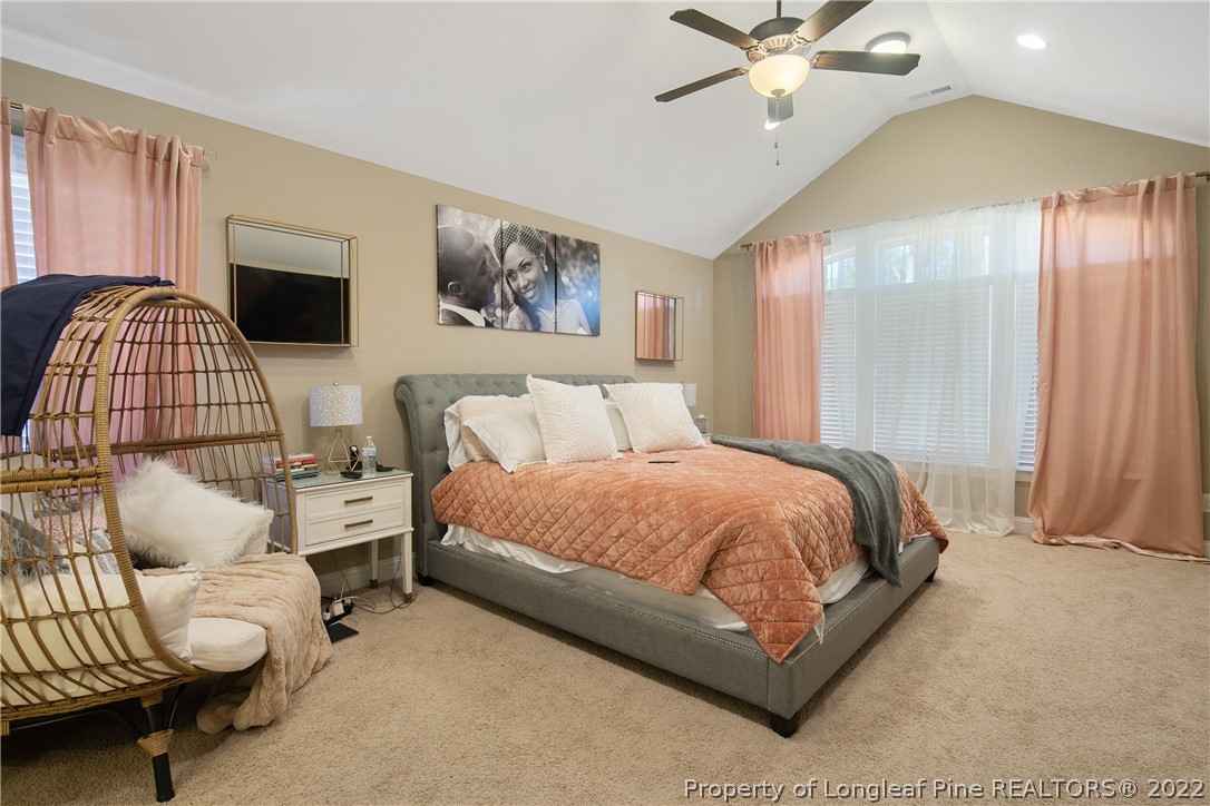 180 The Inner Circle Spring Lake, NC 28390 - Photo 27 of 50 a bedroom with a bed and window