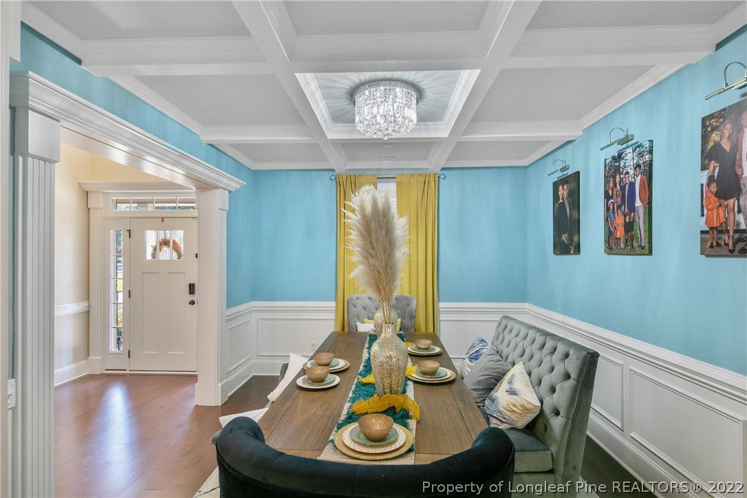 180 The Inner Circle Spring Lake, NC 28390 - Photo 7 of 50 a dining room with furniture and a chandelier
