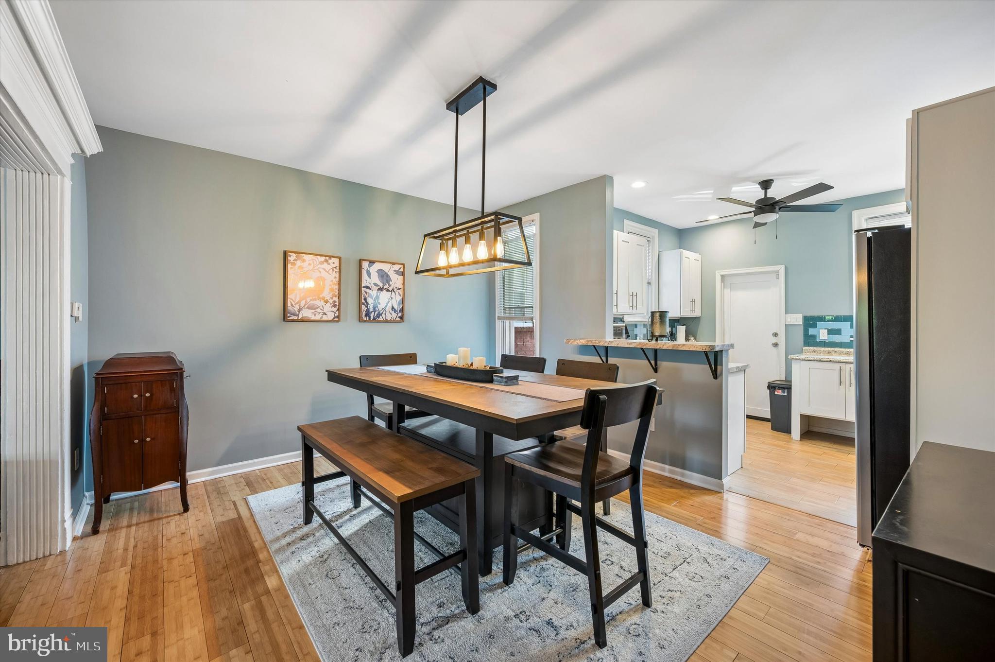 873 Granite Street Philadelphia, PA 19124 - Photo 6 of 24 Dining Room set with wooden chairs and a bench.