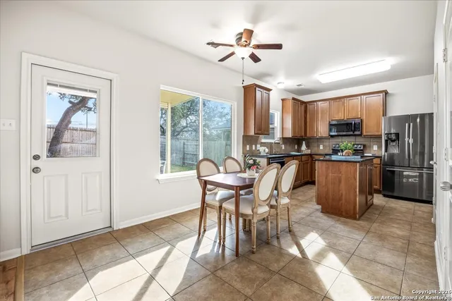 a view of a dining room with furniture window and outside view