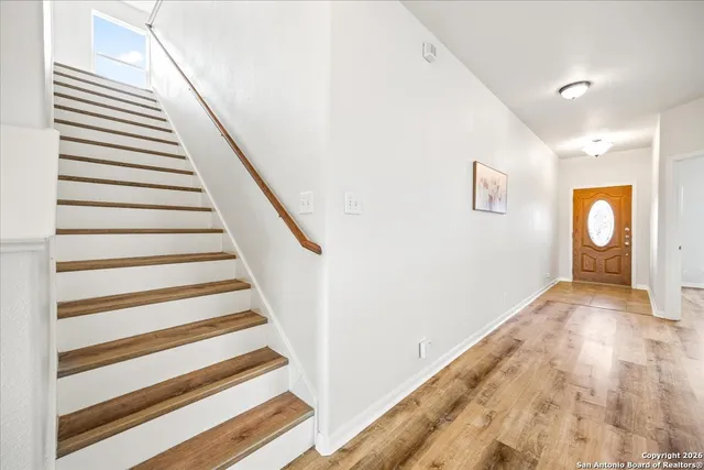 a view of a hallway with stairs