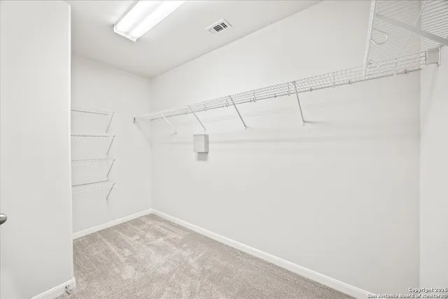 a view of a room with racks on the wall